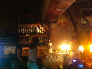 a ruined piano serves as the bar shelves at Szimpla