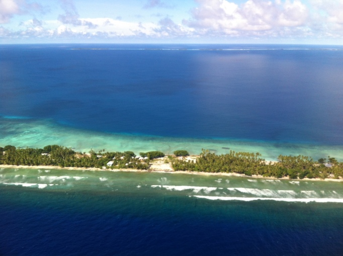 Majuro atoll, in the forefront and faintly in the background