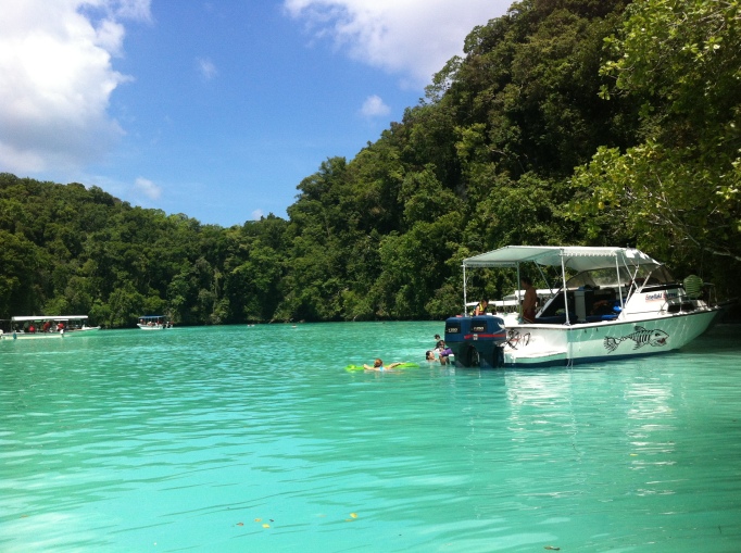 boatloads of Chinese tourists empty out at the Milky Way in Palau's Rock Islands