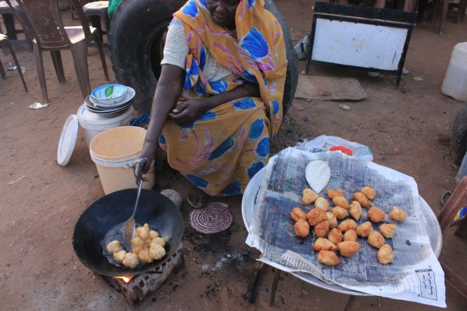 Street food in Sudan: fried and sugar coated donuts