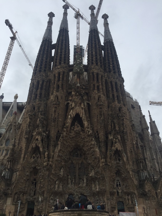 The Segrada familia cathedral, slightly shrouded by cranes and construction